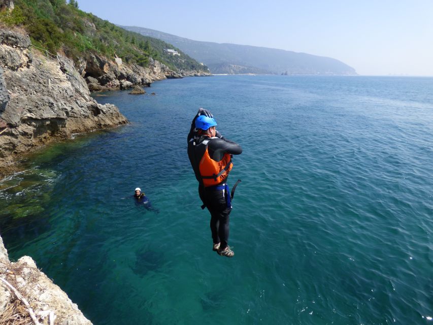 Portinho da Arrábida: Coasteering Boat Tour - Zip lining and swimming into clear water