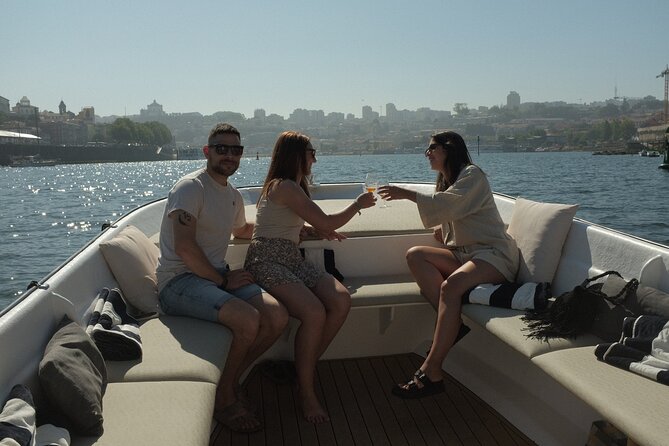 Porto: Douro River Boat Cruise with Port Wine and Snacks - Porto’s bridges, from old ironwork to modern traffic