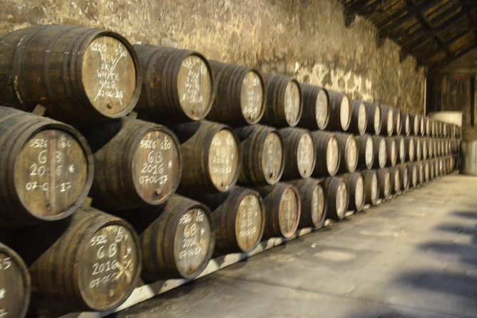 Porto: Port and Douro Wine Walking Tour With 9 Wine Tastings - Third stop: Fonseca for a fuller cellar lesson