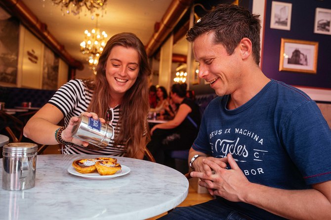 Porto Private Food and Drink Tasting Tour with Local - Galerias Palladium between the tasting stops