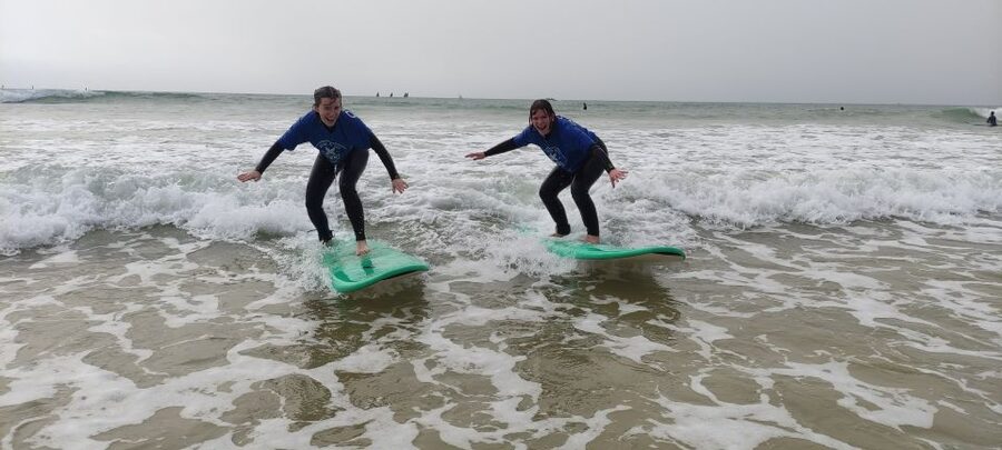 Quarteira: 2-Hour Surf Lesson at Falésia Beach - Getting into the water under instructor supervision