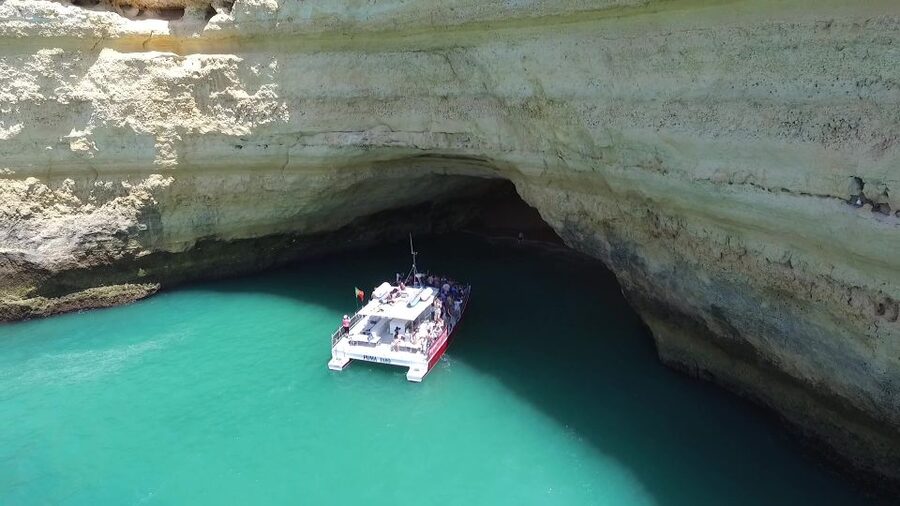 Quarteira: Benagil Cave Guided Catamaran Day Cruise & Drink - Leaving Vilamoura Marina for the Algarve coast