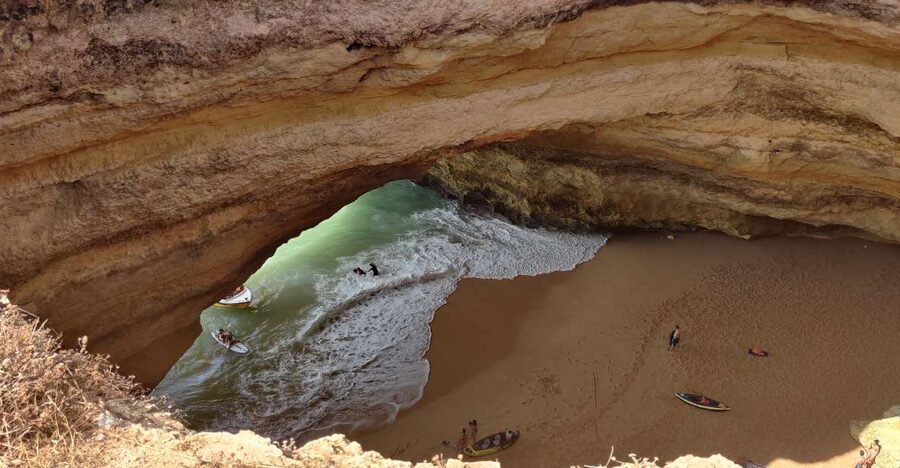 Quarteira: Benagil Cave Guided Catamaran Day Cruise & Drink - Entering Benagil Cave by catamaran