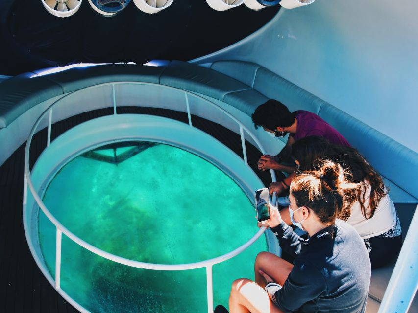 São Miguel: Glass Bottom Boat Tour with Snorkeling - Circling Ilhéu de Vila Franca do Campo