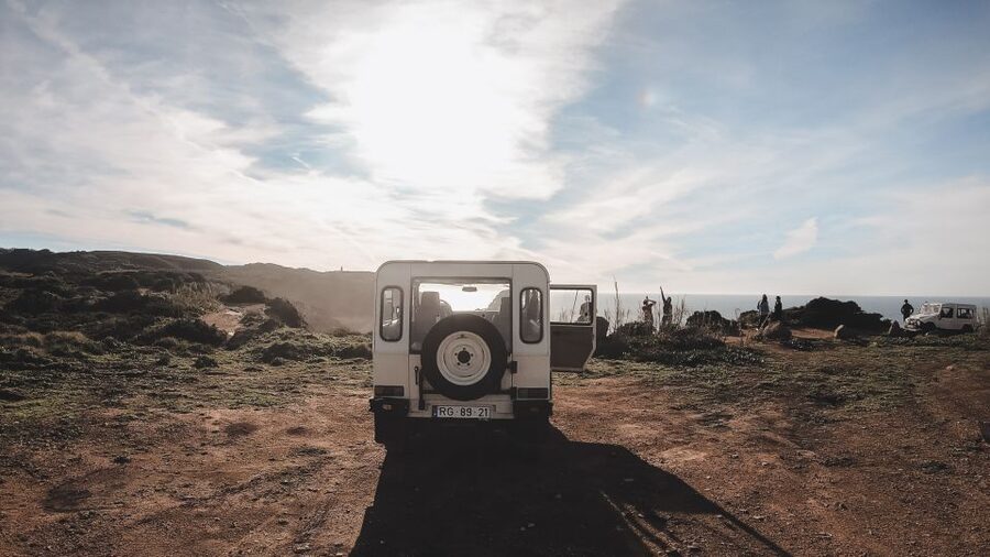Sintra: Regaleira, Cabo da Roca and Cascais Jeep Safari Tour - Guincho Beach, pastry, and Portuguese drinks