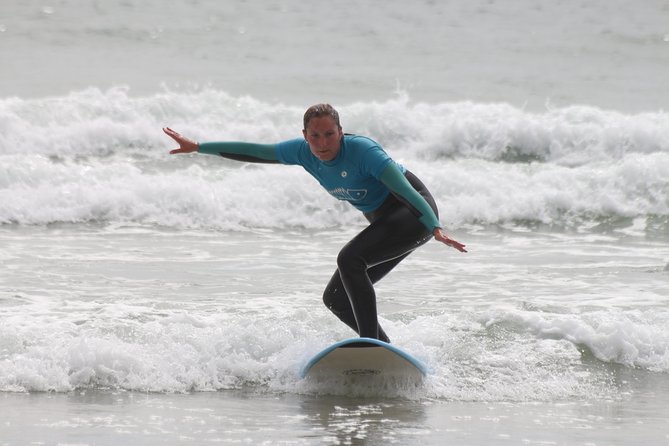 Surf class in Porto - small groups, ideal for beginners - Into the Atlantic with board, wetsuit, and leash