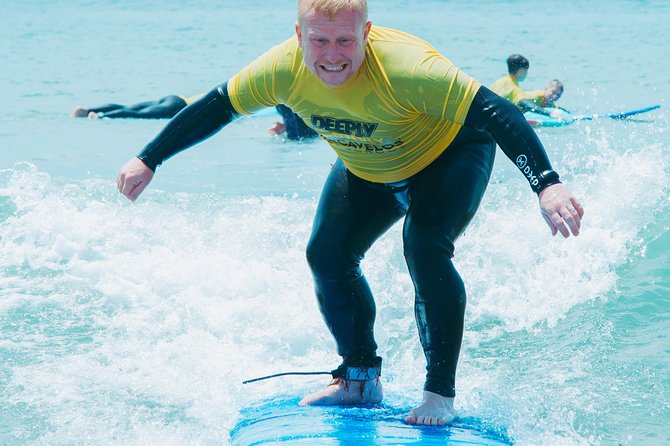 Surf Lesson on Praia de Carcavelos - Entering the Atlantic with an instructor nearby